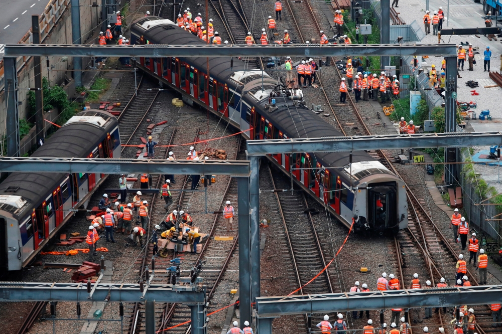 A Mass Transit Railway (MTR) train is seen derailed on the East Rail line in Hong Kong on Tuesday. -Reuters
