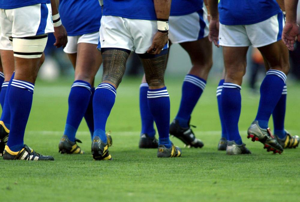 In this file photo taken on Nov. 1, 2003, the tattooed legs of Samoa’s Lome Fa’atau during the Rugby World Cup 2003, South Africa vs Samoa in Brisbane, Australia. — Reuters