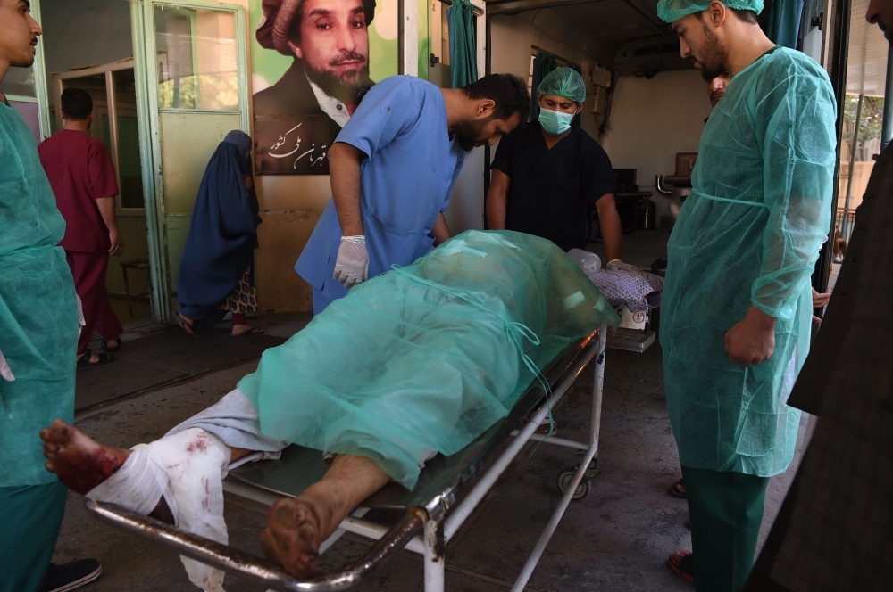 A wounded Afghan man receives treatment at the Wazir Akbar Khan hospital following a blast in Kabul on Tuesday. — AFP
