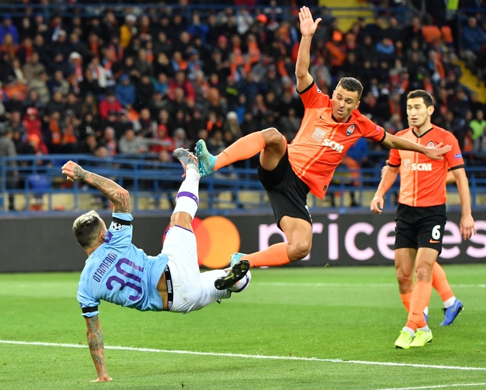 Manchester City's Argentinian defender Nicolas Otamendi and Shakhtar Donetsk's Ukrainian forward Junior Moraes vie for the ball during the UEFA Champions League Group C football match at the OSK Metalist stadium in Kharkiv on Wednesday. — AFP