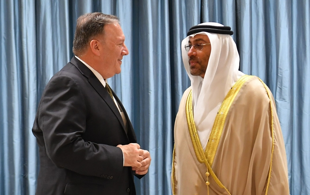 US Secretary of State Mike Pompeo talks to United Arab Emirates Minister of State Ahmed Al-Sayegh upon his arrival at Al-Bateen Air Base in Abu Dhabi on Thursday. — AFP 