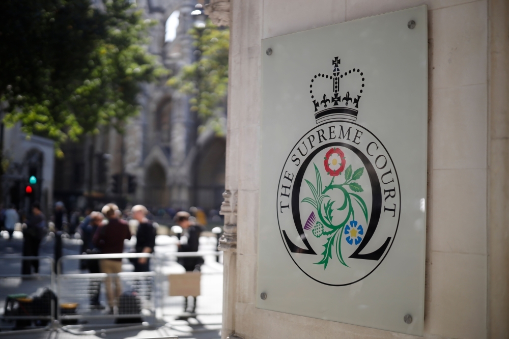 The logo for the Supreme court at the entrance to the court in central London on the third and final day of the hearing into the decision by the government to prorogue parliament on Thursday.  — AFP