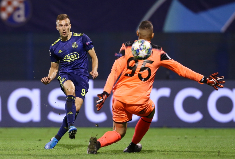 GNK Dinamo Zagreb's Mislav Orsic scores their fourth goal to complete his hat-trick against Atalanta during the Champions League  Group C match at the Stadion Maksimir, Zagreb, Croatia, on Wednesday. — Reuters