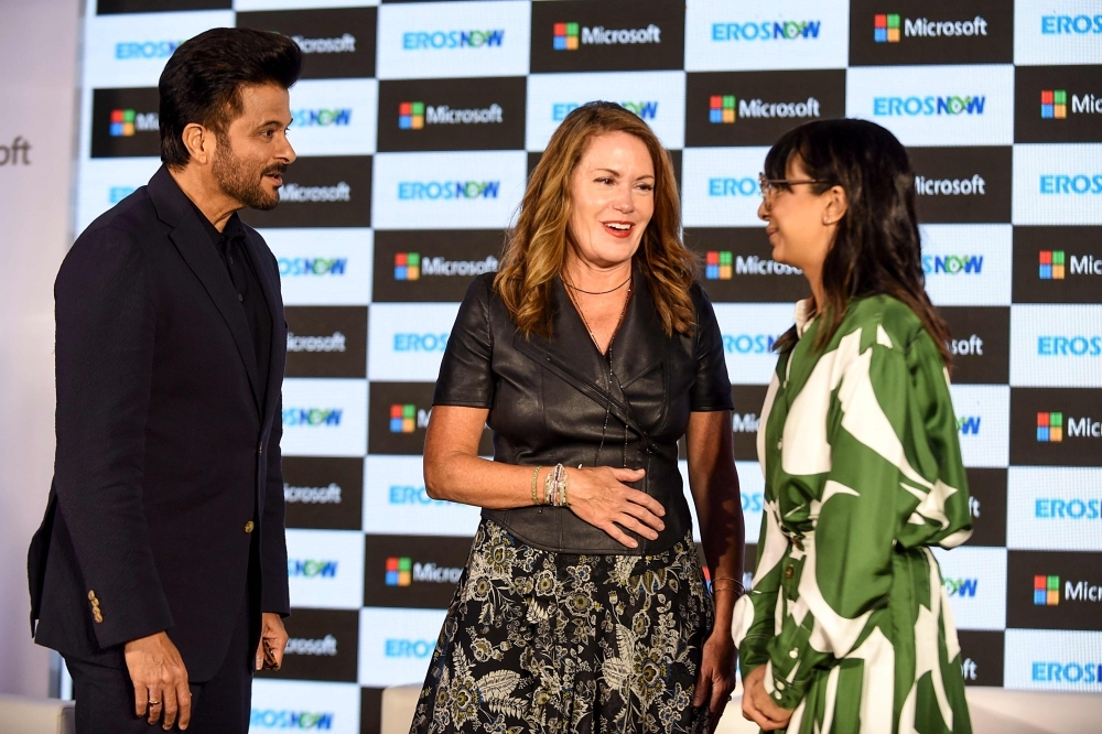 Bollywood actor Anil Kapoor (L), Executive Vice President of Business Development at Microsoft Corp Peggy Johnson (C) and CEO at Eros Digital Rishika Lulla Singh (R) interact during the launch of new streaming service 'Eros Now' in collaboration with Microsoft in Mumbai on Wednesday. — AFP