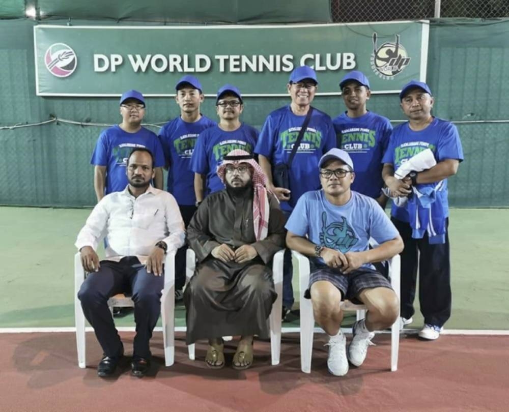 The SPTC, Samahang Pinoy Tennis Club, led by their chairman, JM Bravo (standing, extreme left)