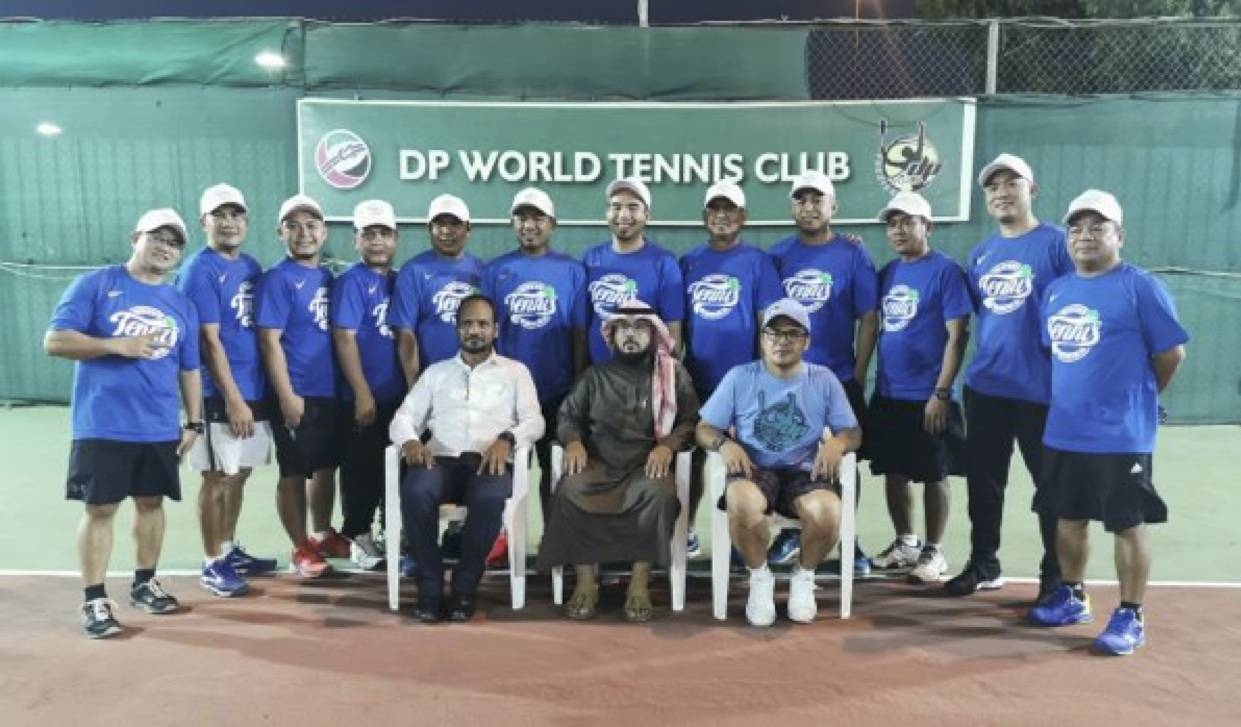 The SPTC, Samahang Pinoy Tennis Club, led by their chairman, JM Bravo (standing, extreme left)