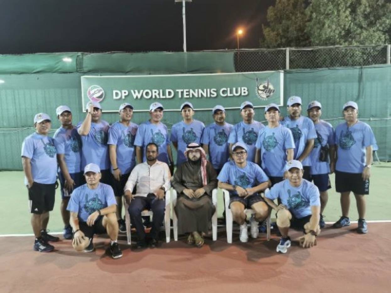 The SPTC, Samahang Pinoy Tennis Club, led by their chairman, JM Bravo (standing, extreme left)