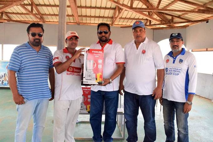 Saghir of Malik XI receving JCA Summer Winner Cup from JCA President Aijaz Khan