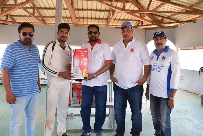 Saghir of Malik XI receving JCA Summer Winner Cup from JCA President Aijaz Khan