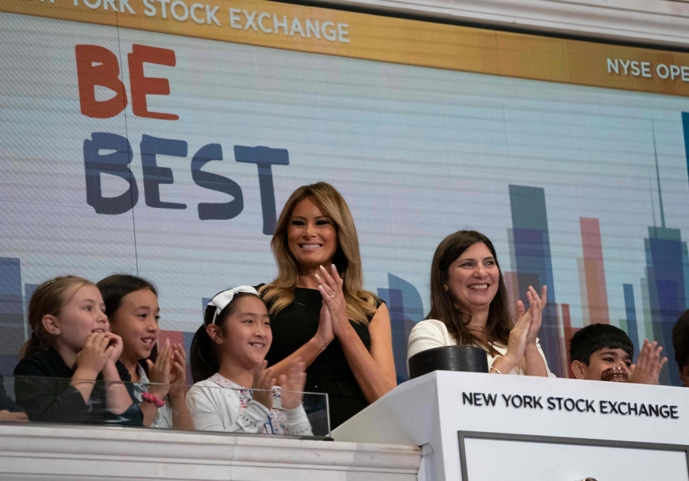US First Lady Melania Trump (L) visits the New York Stock Exchange, along with NYSE President Stacey Cunningham on Monday in New York.  —  AFP