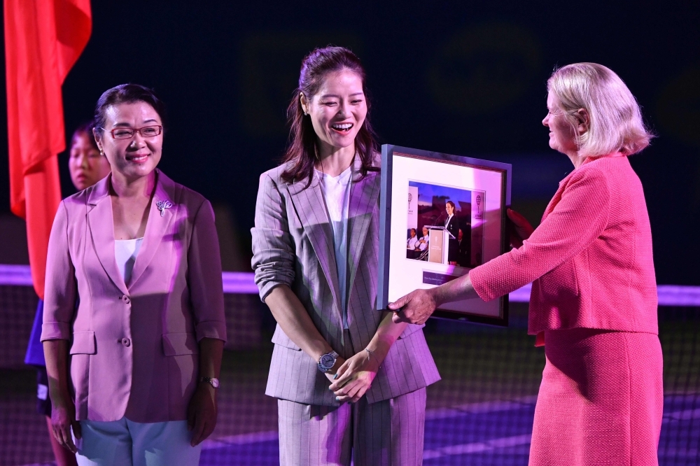 Retired Chinese tennis star Li Na speaks during the opening ceremony on the first day of action at the Wuhan Open tennis tournament in Wuhan n Sunday. — AFP