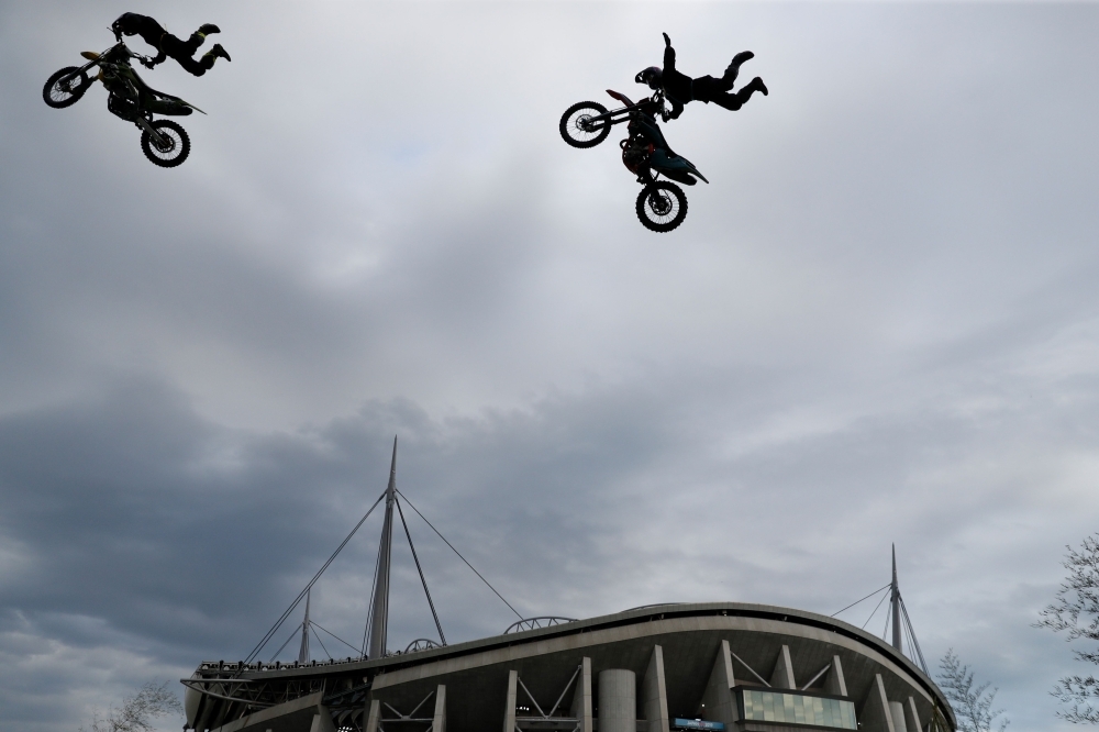Motorcycle acrobats perform outside the City of Toyota Stadium in Toyota City ahead of the Japan 2019 Rugby World Cup Pool D match between Wales and Georgia on Monday. — AFP