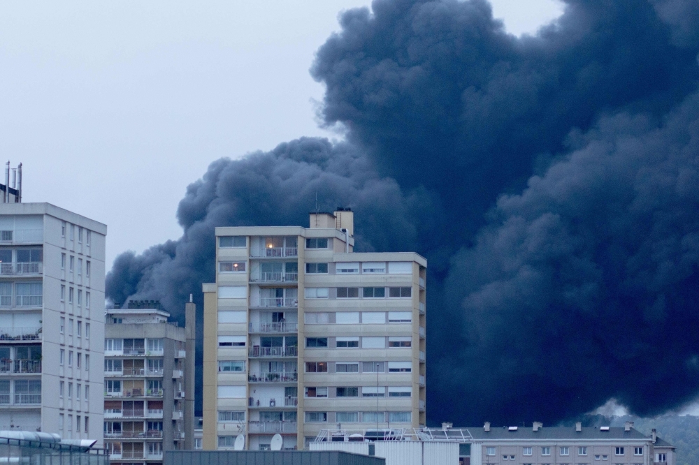 Smoke billows from a Seveso classified Lubrizol factory on fire in Rouen, northern France, on Thursday. — AFP