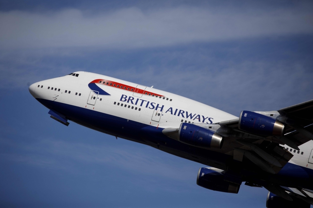 A British Airways plane takes off from the runway at Heathrow Airport's Terminal 5 in west London in this Sept. 13, 2019 file photo. — AFP