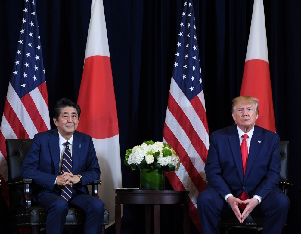 US President Donald Trump and Japanese Prime Minister Shinzo Abe hold a meeting in New York on Wednesday on the sidelines of the United Nations General Assembly. — AFP