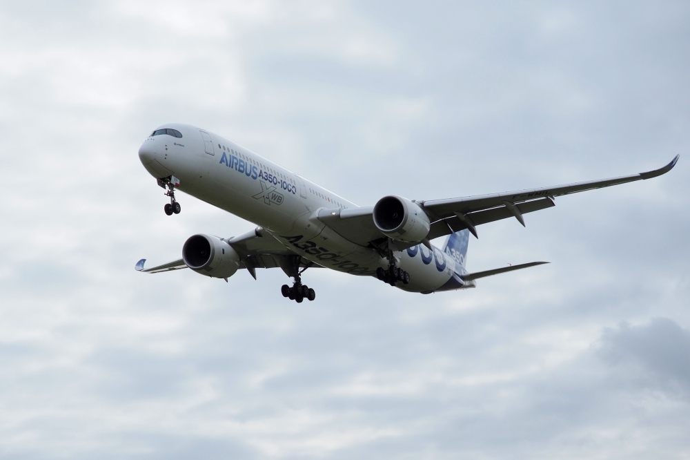 In this file photo taken on Feb. 8, 2019 an Airbus A350-1000 conducts a test flight over Chateauroux airport, central France. European aerospace giant Airbus has been hit by a series of attacks by hackers who targeted its suppliers in their search for commercial secrets, security sources told AFP, adding they suspected a China link. — AFP