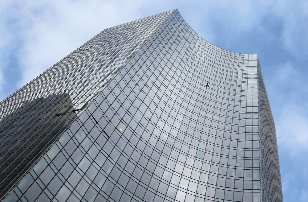 TOPSHOT - French urban climber Alain Robert, popularly known as the 