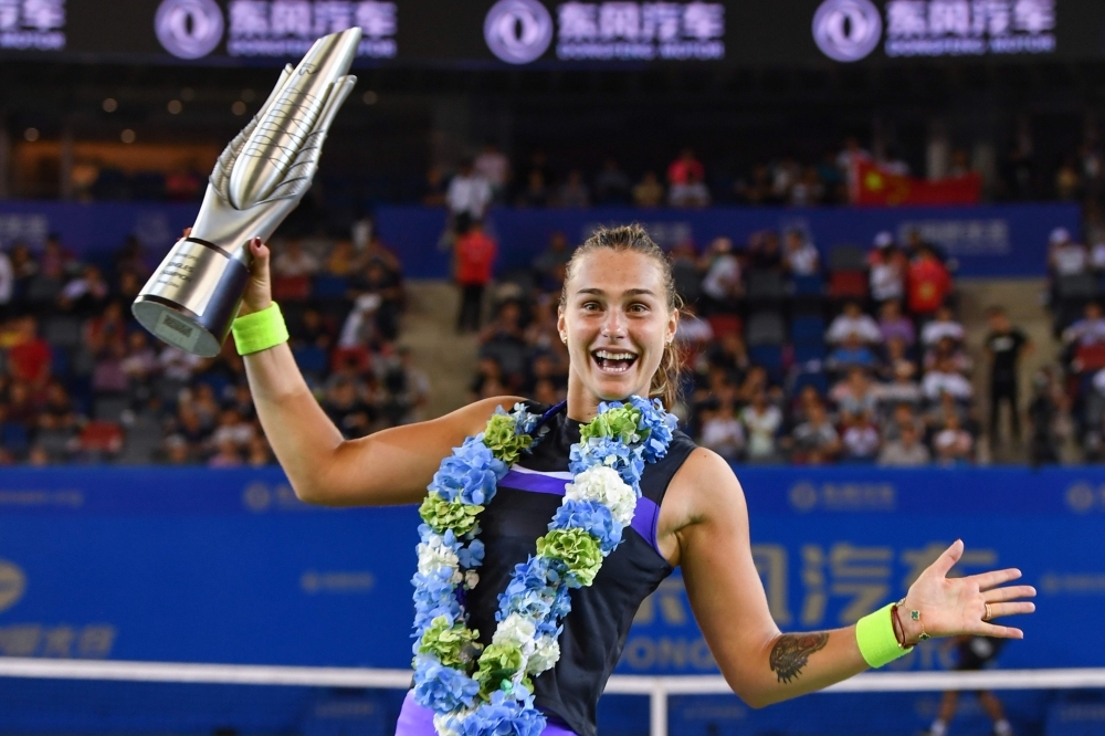 Aryna Sabalenka of Belarus holds the trophy after her victory in the women's singles final match against Alison Riske of the US at the Wuhan Open tennis tournament in Wuhan, on Saturday. — AFP