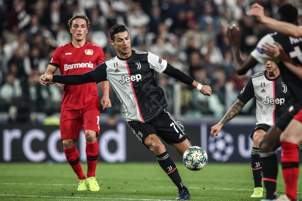 Juventus' Portuguese forward Cristiano Ronaldo (C) shoots on goal during the UEFA Champions League Group D stage football match Juventus vs Bayer Leverkusen  at the Juventus stadium in Turin, on Tuesday. — AFP