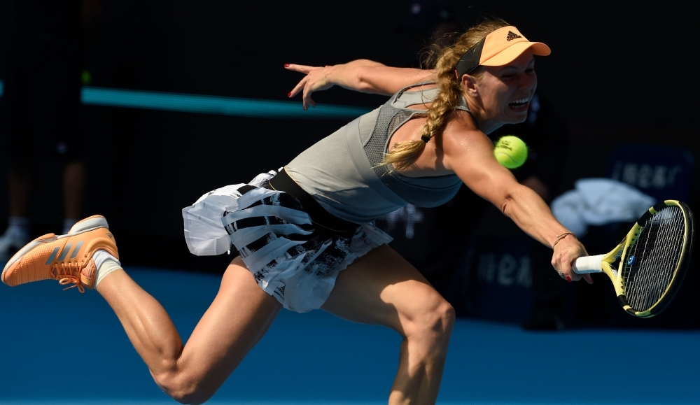 Caroline Wozniacki of Denmark reaches for a return during her women's singles third round match against Katerina Siniakova of the Czech Republic at the China Open tennis tournament in Beijing on Thursday. — AFP