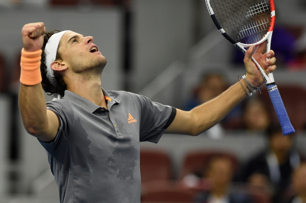 Dominic Thiem of Austria celebrates after winning his men's singles quarterfinal match against Andy Murray of Britain at the China Open tennis tournament in Beijing on Friday. — AFP