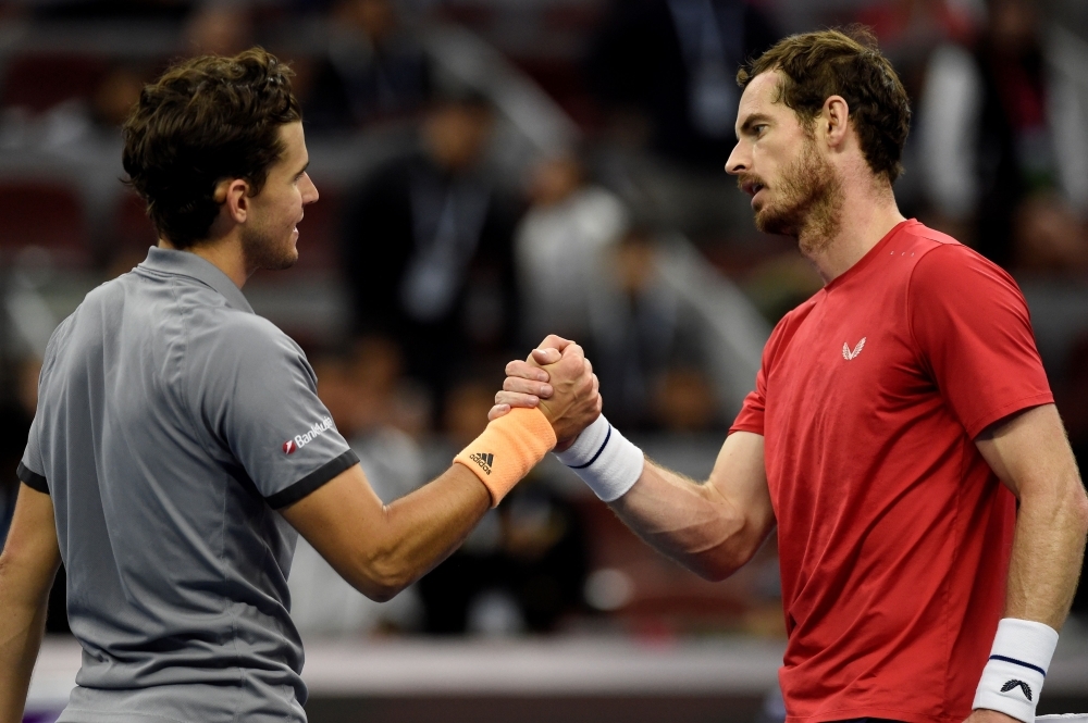 Dominic Thiem of Austria celebrates after winning his men's singles quarterfinal match against Andy Murray of Britain at the China Open tennis tournament in Beijing on Friday. — AFP