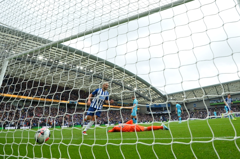Brighton's Irish striker Aaron Connolly (L) scores his team's third goal past Tottenham Hotspur's Argentinian goalkeeper Paulo Gazzaniga during the English Premier League football match between Brighton and Tottenham Hotspur at the American Express Community Stadium in Brighton, southern England, on Saturday. — AFP