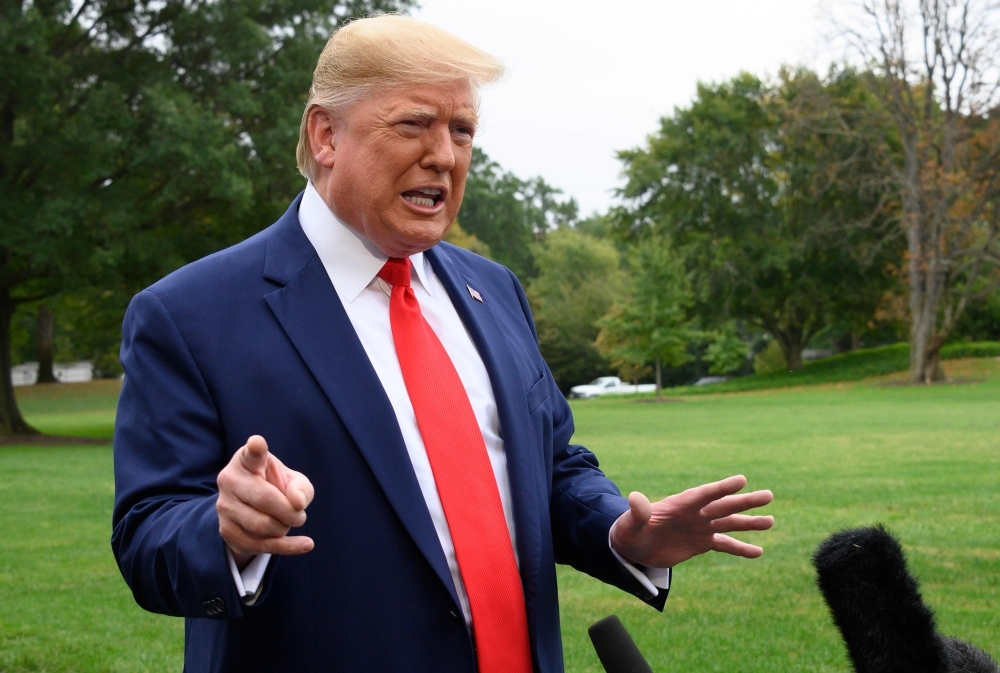 In this file photo taken on Oct. 3, 2019 US President Donald Trump speaks to the press as he departs the White House in Washington, DC, for Florida. A second whistleblower has comes forward, this one with first-hand information of the events that triggered an impeachment investigation of President Donald Trump for alleged abuse of power, the informant's lawyer said Sunday. — AFP