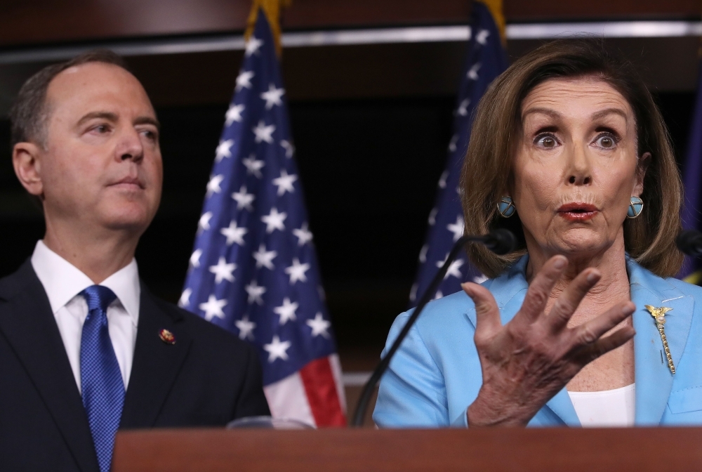 Speaker of the House Nancy Pelosi, right, answers questions with House Select Committee on Intelligence Chairman Rep. Adam Shiff (D-CA) at the US Capitol in Washington in this Oct. 2, 2019 file photo. — AFP