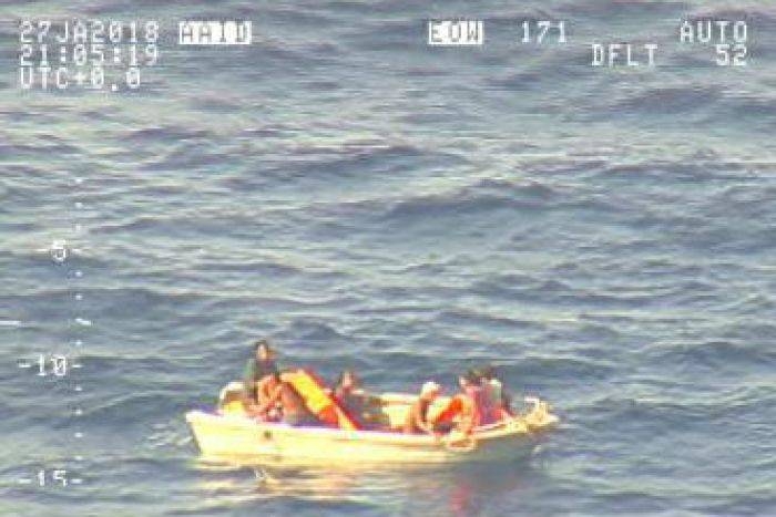 Survivors of MV Butiraoi adrift in a lifeboat who were spotted by Royal New Zealand Air Force P-3K2 Orion aircraft are seen in this file video grab. — AFP