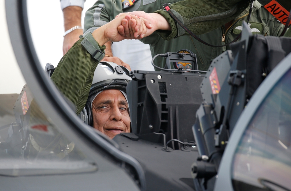 India's Defense Minister Rajnath Singh sits in the first Indian Air Force Rafale fighter jet on the tarmac  before its take-off at the factory of French aircraft manufacturer Dassault Aviation in Merignac near Bordeaux, France, on Tuesday. — Reuters