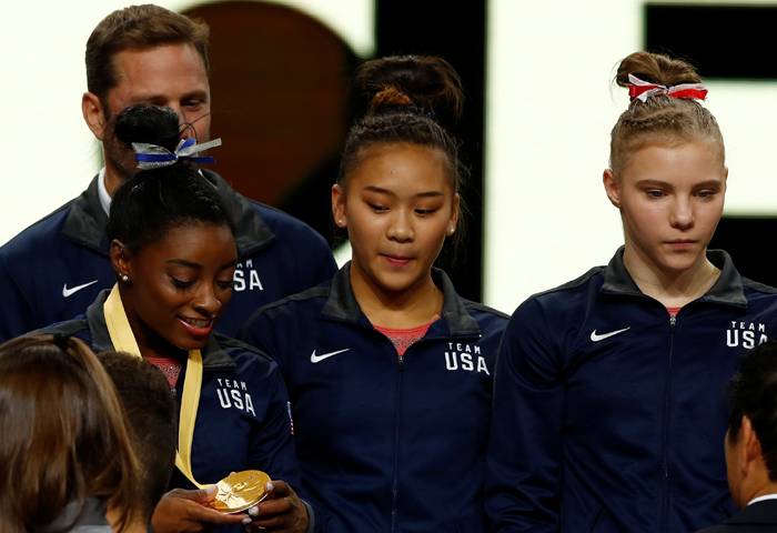 (L-R) Gold medalists Simone Biles, Sunisa Lee and Jade Carey of the US on the podium after the women's team final at the 2019 World Artistic Gymnastics Championships in Hanns-Martin-Schleyer-Halle, Stuttgart, Germany, on Tuesday. — Reuters