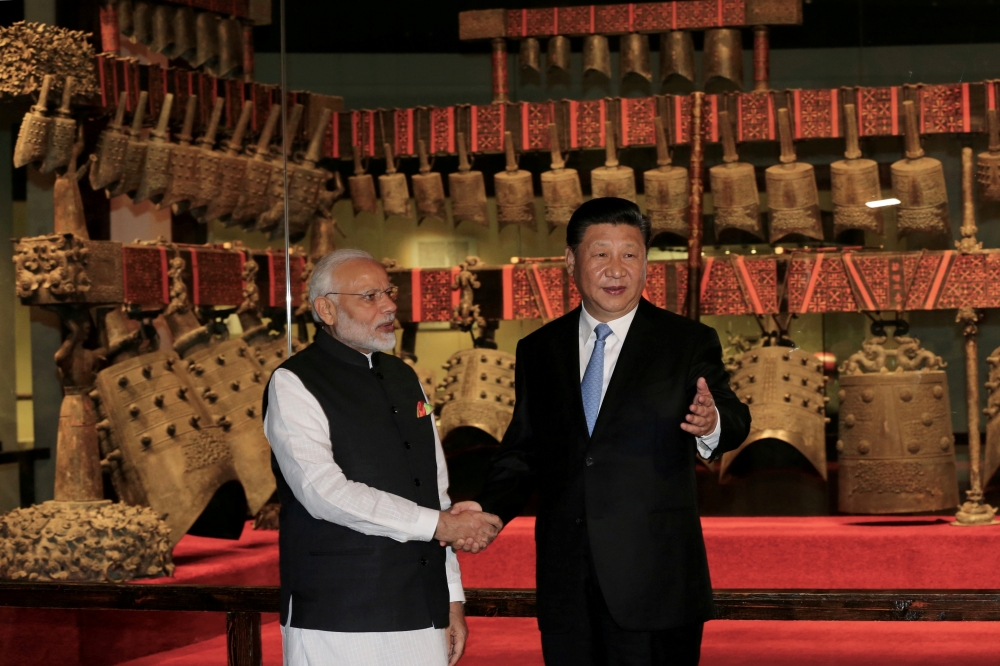 Chinese President Xi Jinping and Indian Prime Minister Narendra Modi shake hands as they visit the Hubei Provincial Museum in Wuhan, Hubei province, China, in this April 27, 2018 file photo. — Reuters 