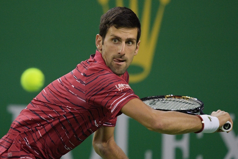 Novak Djokovic of Serbia hits a return during his men's singles second round match against Denis Shapovalov of Canada at the Shanghai Masters tennis tournament in Shanghai, on Wednesday. — AFP