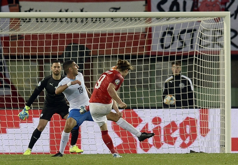 Austria's Marcel Sabitzer (R) scores during the UEFA Euro 2020 Group G qualification football match against Israel in Vienna on  Thursday. — AFP