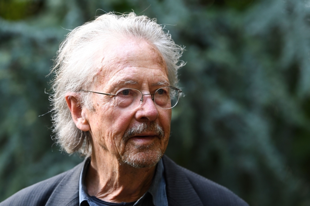 Austrian writer Peter Handke poses in Chaville, in the Paris suburbs, on Thursday after he was awarded with the 2019 Nobel Literature Prize. — AFP