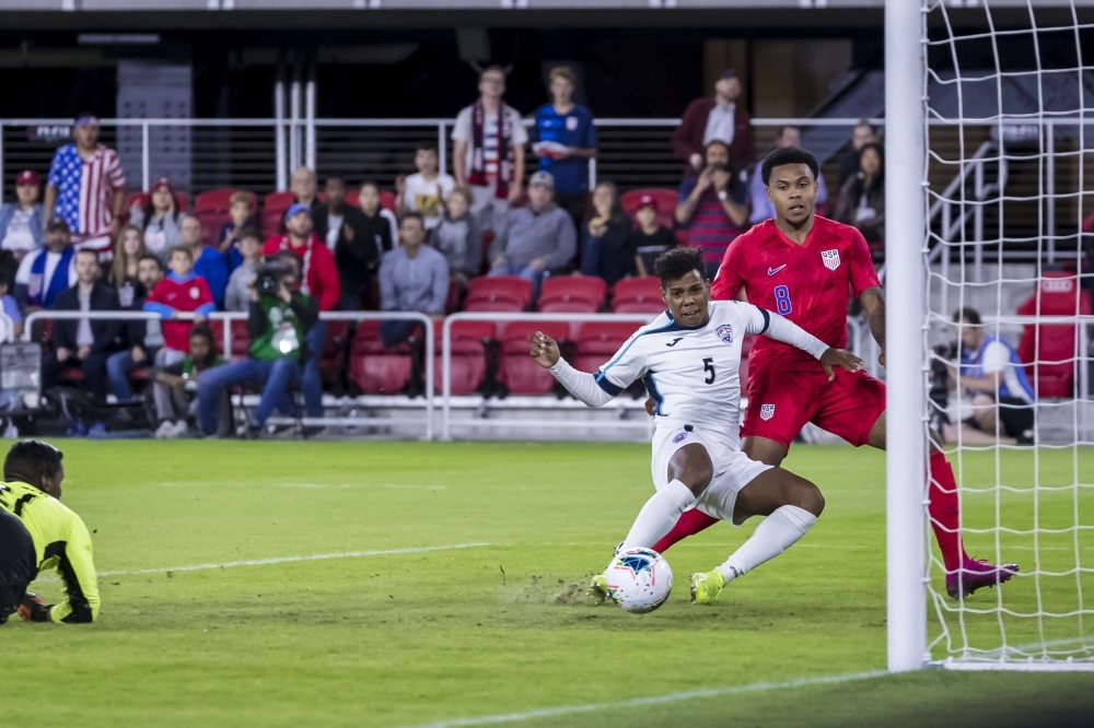 Weston Mckennie of the United States scores a goal against Nelson Johnston of Cuba during the first half at Audi Field in Washington, DC, on Friday. — AFP