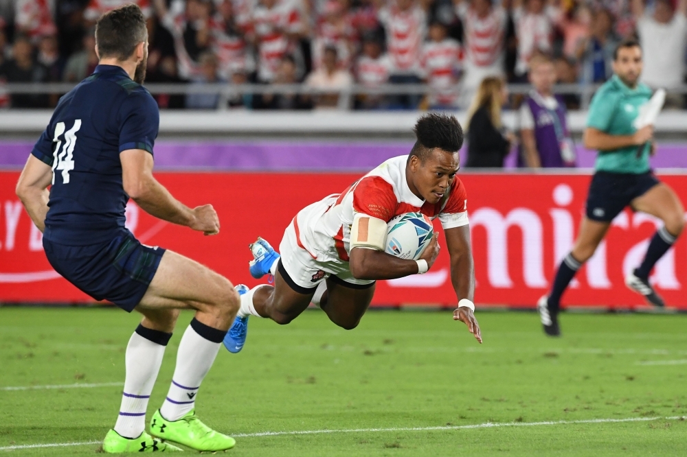 Japan's wing Kotaro Matsushima (C) scores a try during the Japan 2019 Rugby World Cup Pool A match between Japan and Scotland at the International Stadium Yokohama in Yokohama, on Sunday. — AFP