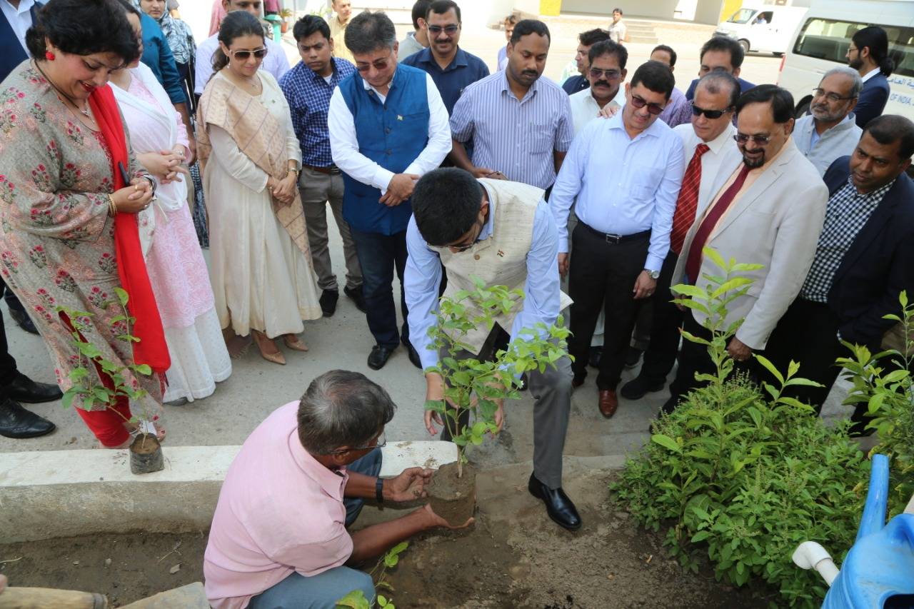 Consul General Mohammed Noor Rahman Sheikh, his wife, Dr. Nazneen Rahman, plant trees as part of the celebrations. — Photos by Krishna Chemmad