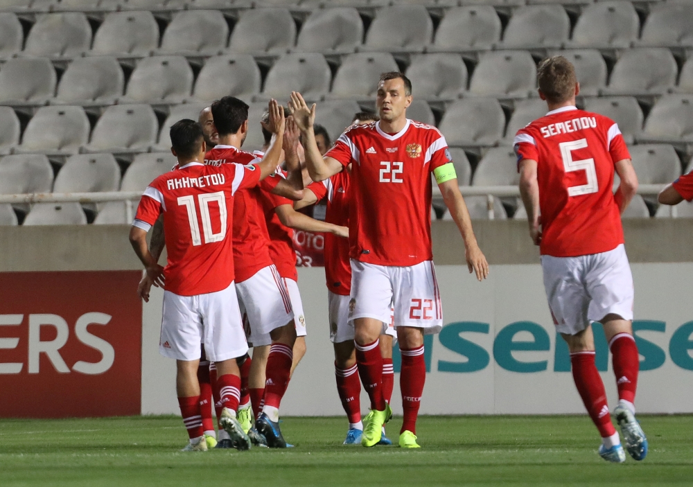 Russia's Magomed Ozdoev celebrates scoring their second goal with Artem Dzyuba and teammates against Cyprus during the Euro 2020 Qualifier Group I match at GSP Stadium, Strovolos, Cyprus, on Sunday. — Reuters