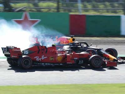 Red Bull's Max Verstappen collides with Ferrari's Charles Leclerc (front) at the Japanese Grand Prix. — AFP