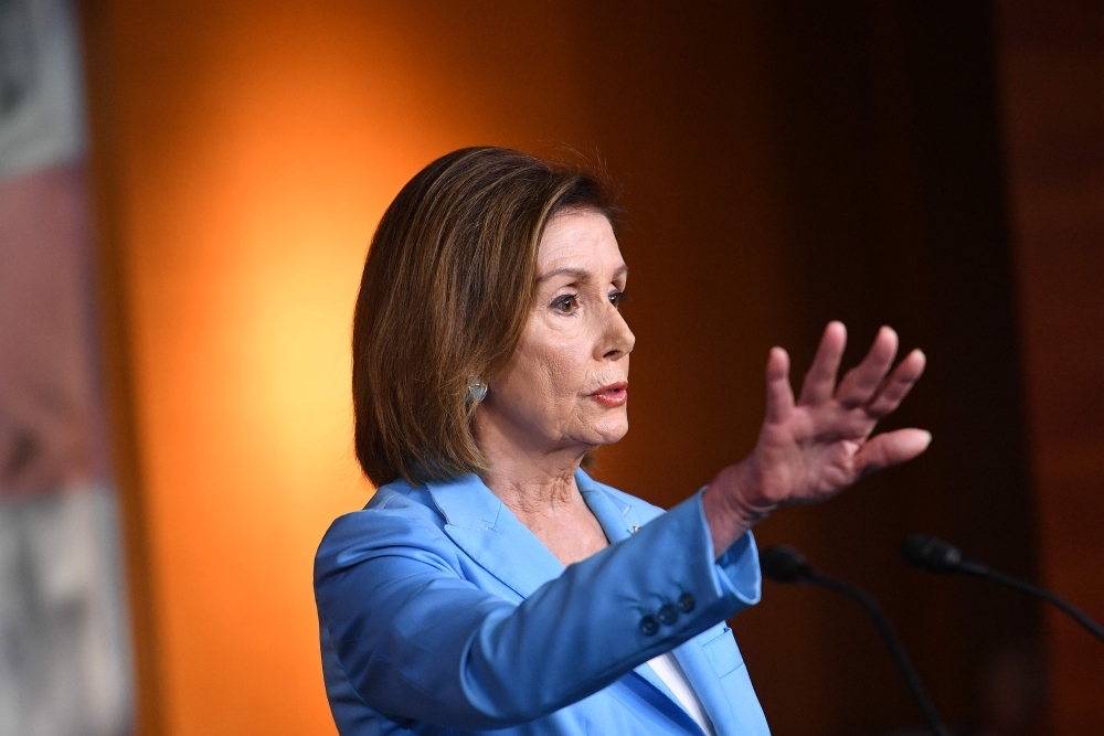 House Speaker Nancy Pelosi and House Intelligence Committee Chair Adam Schiff, not shown, D-CA, speak during a press conference in the House Studio of the US Capitol in Washington in this Oct. 02, 2019 file photo. — AFP