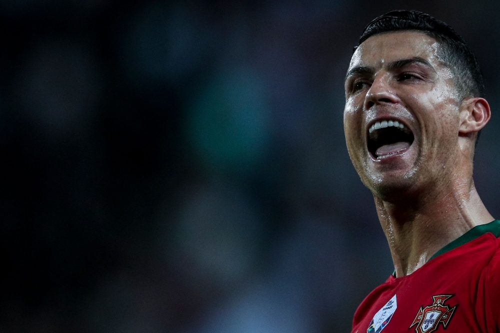 Portugal's forward Cristiano Ronaldo celebrates after scoring a goal during the Euro 2020 qualifier group B football match between Portugal and Luxembourg at the Jose Alvalade stadium in Lisbon on Monday. — Reuters