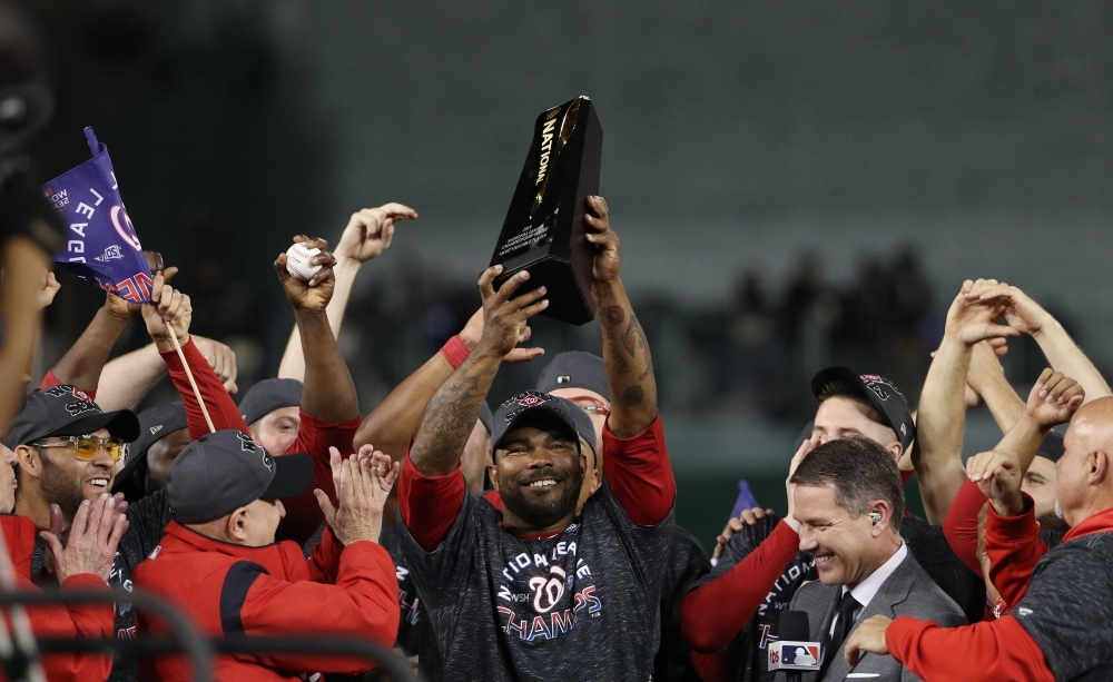 The Washington Nationals celebrate winning game four and the National League Championship Series against the St. Louis Cardinals at Nationals Park on in Washington, DC, on Tuesday. — AFP