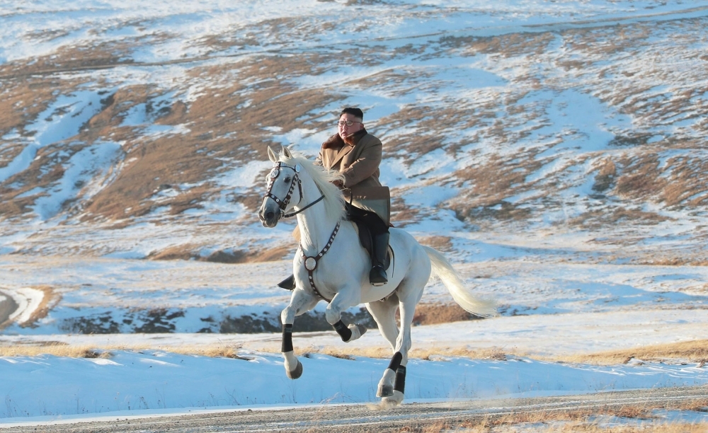 This undated picture released by Korean Central News Agency on Wednesday shows North Korean leader Kim Jong Un riding a white horse amid the first snow at Mount Paektu. — AFP