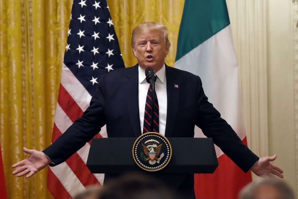 US President Donald Trump answers questions during a joint press conference with Italian President Sergio Mattarella, not pictured, at the White House in Washington, on Wednesday. — AFP