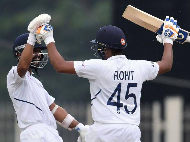 India`s Rohit Sharma (R) celebrates his century (100 runs) with teammate Ajinkya Rahane during the first day of the third and final Test match between India and South Africa at the Jharkhand State Cricket Association (JSCA) stadium in Ranchi on Saturday. — AFP