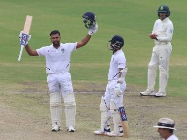 India`s Rohit Sharma (R) celebrates his century (100 runs) with teammate Ajinkya Rahane during the first day of the third and final Test match between India and South Africa at the Jharkhand State Cricket Association (JSCA) stadium in Ranchi on Saturday. — AFP