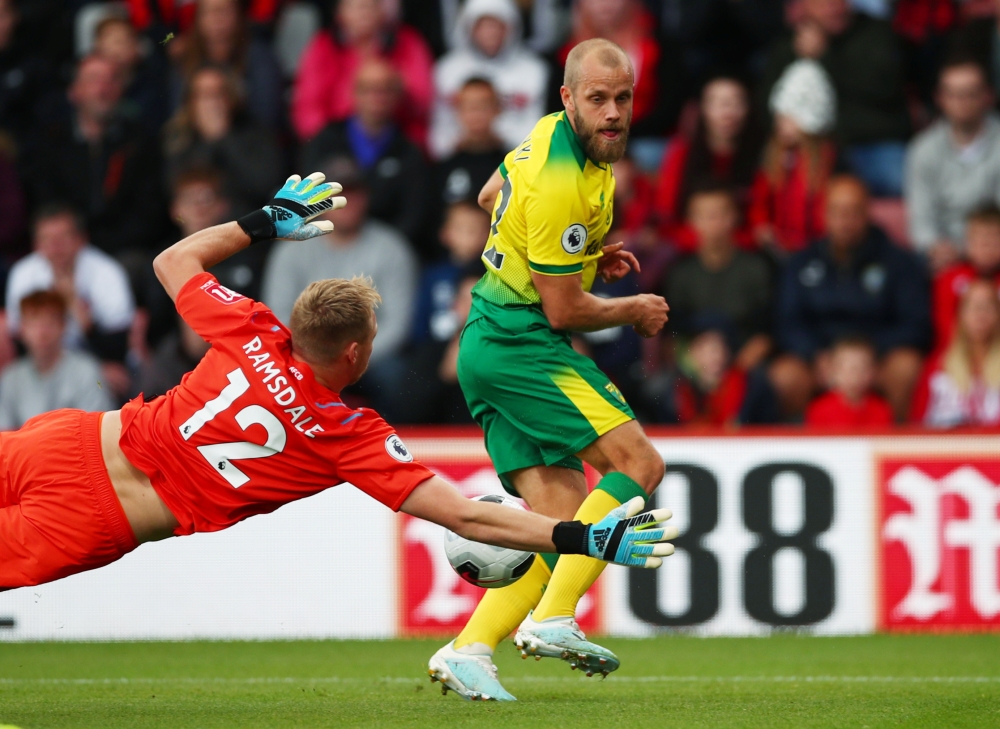 Bournemouth's Aaron Ramsdale in action with Norwich City's Teemu Pukki at Vitality Stadium, Bournemouth, Britain, on Saturday. — Reuters