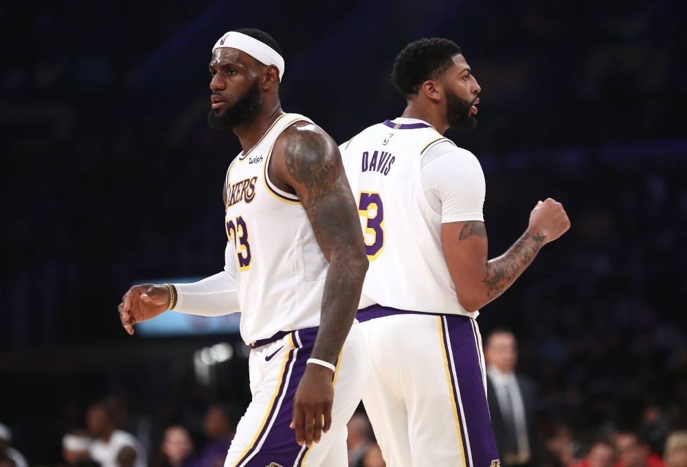 In this file photo taken on Oct. 16, 2019, LeBron James (L) and Anthony Davis (R) of the Los Angeles Lakers look on during the second half of a game against the Golden State Warriors at Staples Center in Los Angeles. The first chapter in the most compelling storyline of the new NBA season will be written on October 22, as LeBron James and the Los Angeles Lakers face off against Kawhi Leonard and the Los Angeles Clippers. — AFP